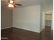 Bedroom featuring hardwood floors, neutral walls, and an adjacent closet at 2830 W Grenadine Rd, Phoenix, AZ 85041