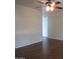 Bedroom showcasing neutral walls, hardwood floors, ceiling fan, and bright lighting at 2830 W Grenadine Rd, Phoenix, AZ 85041