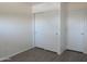 Clean bedroom with sliding-door closet at 2830 W Grenadine Rd, Phoenix, AZ 85041