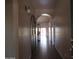 Inviting hallway with arched doorway leading to living spaces and tile floors at 2830 W Grenadine Rd, Phoenix, AZ 85041