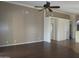 Spacious living room with ceiling fan and neutral walls offers a versatile living space at 2830 W Grenadine Rd, Phoenix, AZ 85041