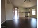 Open living space connecting the kitchen, dining, and living areas with diverse flooring at 2830 W Grenadine Rd, Phoenix, AZ 85041