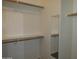 Walk-in closet with a mirror and shelf at 2830 W Grenadine Rd, Phoenix, AZ 85041