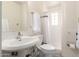 Bright bathroom featuring tiled shower, updated vanity and mirror at 3028 E Highland Ave, Phoenix, AZ 85016