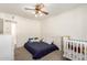 Cozy bedroom features a ceiling fan, closet and a bed, perfect for a Bedroom at 3028 E Highland Ave, Phoenix, AZ 85016