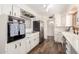 Modern kitchen with white cabinets, stainless steel appliances, and subway tile backsplash at 3028 E Highland Ave, Phoenix, AZ 85016