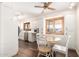 Eat-in kitchen featuring white cabinetry, stainless steel appliances, and a dining area at 3028 E Highland Ave, Phoenix, AZ 85016