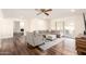 Bright living room with wood floors, ceiling fan, and sliding glass doors to the patio at 3028 E Highland Ave, Phoenix, AZ 85016