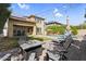 Enjoyable backyard featuring a swimming pool, string lights, and seating and lounge areas at 3541 E Amber Ln, Gilbert, AZ 85296