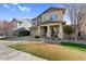 Charming two-story home featuring a two-car garage, stone accents, and a welcoming front porch at 3541 E Amber Ln, Gilbert, AZ 85296