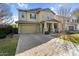 Charming two-story home featuring a two-car garage, stone accents, and a welcoming front porch at 3541 E Amber Ln, Gilbert, AZ 85296