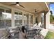 Cozy covered patio seating area with ceiling fans and view to yard and outdoor living space at 3541 E Amber Ln, Gilbert, AZ 85296