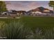 Expansive community green space featuring a covered pavilion against a backdrop of desert mountain views at 3572 W Horse Trail Way, San Tan Valley, AZ 85144