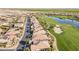 Aerial view of a planned community with golf course, lush landscaping, and neatly lined homes at 36518 N Crucillo Dr, Queen Creek, AZ 85140