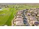 Stunning aerial view of a golf course community with well-maintained homes and lush green fairways at 36518 N Crucillo Dr, Queen Creek, AZ 85140