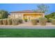 Exterior view showcasing a well-maintained backyard with desert landscaping and inviting outdoor living spaces at 36518 N Crucillo Dr, Queen Creek, AZ 85140