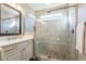 Bright bathroom featuring a frameless glass shower with river rock floor at 36518 N Crucillo Dr, Queen Creek, AZ 85140