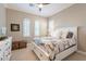 Serene bedroom with large windows, a patterned bedspread, and a decorative chest at 36518 N Crucillo Dr, Queen Creek, AZ 85140