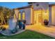 Inviting home entrance with brick pavers and decorative potted plants at 36518 N Crucillo Dr, Queen Creek, AZ 85140