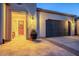 Home exterior featuring a covered entrance and a two-car garage at 36518 N Crucillo Dr, Queen Creek, AZ 85140