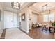 Inviting foyer with tile flooring, modern lighting, and bright entryway showcasing a well-designed home at 36518 N Crucillo Dr, Queen Creek, AZ 85140