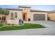 Attractive single-story home with a manicured lawn and beautiful Southwestern-style landscaping at 36518 N Crucillo Dr, Queen Creek, AZ 85140