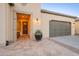 Exterior of home with front door entryway and two-car garage at 36518 N Crucillo Dr, Queen Creek, AZ 85140