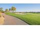 Scenic view of the golf course with lush green fairway and walking path at 36518 N Crucillo Dr, Queen Creek, AZ 85140