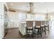 Bright, stylish kitchen with white cabinetry, stainless steel appliances, and a large center island at 36518 N Crucillo Dr, Queen Creek, AZ 85140