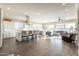 An open-concept living space with a view into the kitchen and abundant natural light at 36518 N Crucillo Dr, Queen Creek, AZ 85140