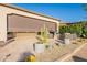 Beautiful patio with retractable sun shade and decorative landscaping at 36518 N Crucillo Dr, Queen Creek, AZ 85140