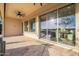 Relaxing covered patio with tile flooring and a ceiling fan for added comfort on warm days at 36518 N Crucillo Dr, Queen Creek, AZ 85140