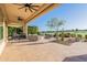 Enjoy the spacious patio with outdoor seating, grilling area, and golf course views at 36518 N Crucillo Dr, Queen Creek, AZ 85140