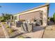 Relaxing patio space featuring desert landscaping, a sunshade, and comfortable outdoor seating at 36518 N Crucillo Dr, Queen Creek, AZ 85140