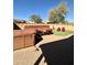 Backyard with hot tub, seating, and artificial turf at 36610 W Picasso St, Maricopa, AZ 85138