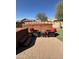 Backyard with hot tub, artificial turf, and desert landscaping at 36610 W Picasso St, Maricopa, AZ 85138