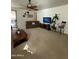 Inviting living room with sliding glass doors and brown sofa at 36610 W Picasso St, Maricopa, AZ 85138