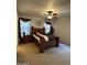 Spacious bedroom featuring a large bed, ceiling fan, and matching wood furniture at 36610 W Picasso St, Maricopa, AZ 85138