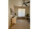 Versatile room with a fan, desk, curtains, and ample space for various uses at 36610 W Picasso St, Maricopa, AZ 85138