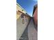 View of block wall side yard with pavers and desert landscaping at 36610 W Picasso St, Maricopa, AZ 85138