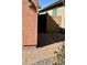 Backyard access featuring a brick-paved path leading to a backyard gate in a home at 36610 W Picasso St, Maricopa, AZ 85138