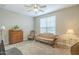 Cozy bedroom with a ceiling fan and two large windows, creating a warm and inviting atmosphere at 38101 W Santa Maria St, Maricopa, AZ 85138