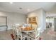 Elegant dining room with hardwood floors, traditional decor, and abundant natural light at 38101 W Santa Maria St, Maricopa, AZ 85138