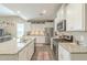 Modern kitchen with granite countertops, stainless steel appliances, and tile flooring at 38101 W Santa Maria St, Maricopa, AZ 85138