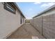 View of side yard with gravel and framed windows at 38101 W Santa Maria St, Maricopa, AZ 85138