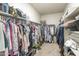 Spacious walk-in closet with ample storage, custom shelving, and hanging rods for an organized wardrobe at 38101 W Santa Maria St, Maricopa, AZ 85138