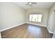 Bright, airy bedroom with wood-look floors at 4002 E Rockwood Dr, Phoenix, AZ 85050