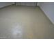 Spacious garage featuring an epoxy-coated floor, ensuring durability and easy maintenance for vehicle parking and storage at 4002 E Rockwood Dr, Phoenix, AZ 85050