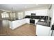 Modern kitchen featuring granite countertops, stainless steel appliances, white cabinetry, and natural light at 4002 E Rockwood Dr, Phoenix, AZ 85050