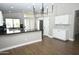 Kitchen area with granite countertops, stainless steel appliances, and wood flooring with an open floorplan concept at 4002 E Rockwood Dr, Phoenix, AZ 85050